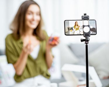A lady recording video for social media marketing