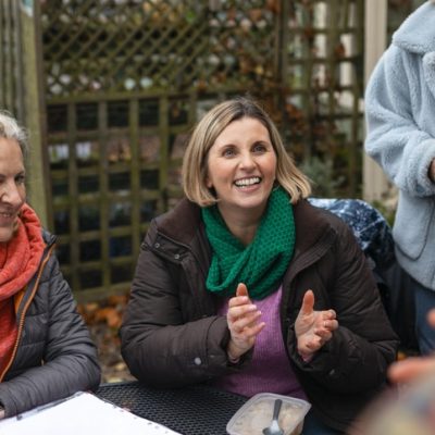 Charity copywriter represented by a group of charity volunteers