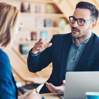 LinkedIn marketing represented by two workers chatting